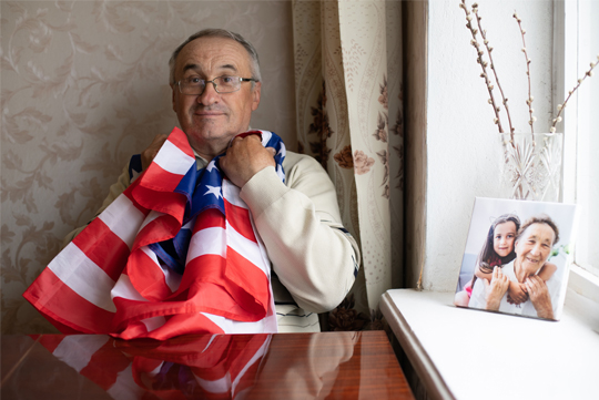 man holding a american flah